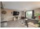 Cozy living room with TV, plush seating, and a view of the outdoors at 11805 W 74Th Ave, Arvada, CO 80005