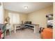 Bedroom has been converted into an office space with desk, chair, window, and neutral walls at 11805 W 74Th Ave, Arvada, CO 80005