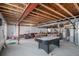 Unfinished basement with game tables and seating at 4357 Ivycrest Pt, Highlands Ranch, CO 80130