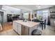 Kitchen island with sink and stainless steel dishwasher at 4357 Ivycrest Pt, Highlands Ranch, CO 80130