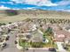 An aerial view showcases the home's location within a well-planned community near green spaces at 9407 W Gibraltar Pl, Littleton, CO 80127