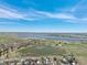 This aerial view showcases the property's proximity to the lake at 9407 W Gibraltar Pl, Littleton, CO 80127