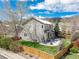 A charming backyard with a green lawn and a patio set, perfect for outdoor dining and entertaining at 9407 W Gibraltar Pl, Littleton, CO 80127