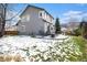 Spacious backyard with a patio area, and a partial fence, perfect for outdoor activities at 9407 W Gibraltar Pl, Littleton, CO 80127