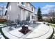 Backyard patio with an outdoor seating area and fire pit, perfect for entertaining guests at 9407 W Gibraltar Pl, Littleton, CO 80127