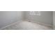 Empty bedroom with carpet, neutral colors, a small window, and electrical outlets at 9407 W Gibraltar Pl, Littleton, CO 80127
