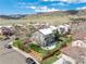 Beautiful home exterior featuring a well-maintained yard and a patio area perfect for outdoor gatherings at 9407 W Gibraltar Pl, Littleton, CO 80127