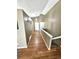 Hallway and foyer featuring wood floors and access to multiple rooms at 5343 S Ukraine Way, Aurora, CO 80015