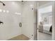 Modern bathroom boasts a glass-enclosed shower with tiled walls and a stone-pebbled shower floor at 1933 W 165Th Way, Broomfield, CO 80023