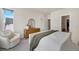 Neutral main bedroom featuring soft chair, wood dresser, and calming decor at 1933 W 165Th Way, Broomfield, CO 80023