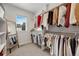 Spacious walk-in closet with custom shelving and clothing racks for optimal organization at 1933 W 165Th Way, Broomfield, CO 80023