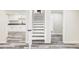 Basement featuring LVP flooring and staircase at 2340 Jamaica St, Aurora, CO 80010