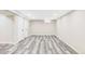 Bright basement featuring recessed lighting and modern gray flooring at 2340 Jamaica St, Aurora, CO 80010