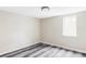 A newly renovated basement room with recessed lighting and a bright window at 2340 Jamaica St, Aurora, CO 80010