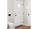 Bright entryway featuring hardwood floors, a modern door with a diamond-shaped window at 2340 Jamaica St, Aurora, CO 80010