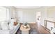 Comfortable living area with a stylish sofa, hardwood floors, and a view into the next room at 2340 Jamaica St, Aurora, CO 80010
