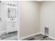 Spacious room with laundry hookups next to a clean, modern bathroom at 2340 Jamaica St, Aurora, CO 80010
