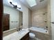 Well-appointed bathroom with tub, single vanity, and tiled walls at 662 Yankakee, Castle Rock, CO 80108