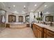 Luxurious bathroom with soaking tub, double vanity, and natural light at 662 Yankakee, Castle Rock, CO 80108