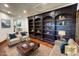 Elegant living room featuring a large built-in bookcase and comfortable seating at 662 Yankakee, Castle Rock, CO 80108