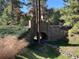 Landscaped grounds with a charming stone bridge and pathway at 662 Yankakee, Castle Rock, CO 80108