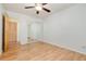 This cozy bedroom has hardwood floors and mirrored closet doors at 5995 W Hampden Ave # 3E, Denver, CO 80227