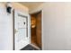 This entryway features the front door and view into the kitchen at 5995 W Hampden Ave # 3E, Denver, CO 80227