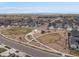 An aerial view of a park in a residential community, with walking paths and play equipment at 24333 E 41St Ave, Aurora, CO 80019