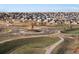 An aerial view of a residential community with a roundabout and modern sculpture at 24333 E 41St Ave, Aurora, CO 80019