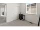 Neutral bedroom with a window, a black printer table, and closet with white doors at 24333 E 41St Ave, Aurora, CO 80019