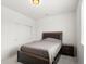 Cozy carpeted bedroom featuring neutral paint, window, and dark bed frame at 24333 E 41St Ave, Aurora, CO 80019