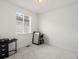 Bright bedroom features a window with blinds and neutral carpet at 24333 E 41St Ave, Aurora, CO 80019