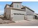 Exterior of modern home with two-car garage and grey siding at 24333 E 41St Ave, Aurora, CO 80019