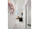 Hallway has a painted wall canvas and a black table in a connected living space at 24333 E 41St Ave, Aurora, CO 80019