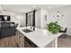 Stylish kitchen with island, stainless steel sink, and open layout at 24333 E 41St Ave, Aurora, CO 80019