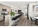 Bright, open-concept kitchen featuring an island with bar seating at 24333 E 41St Ave, Aurora, CO 80019