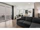 Open floor plan featuring a modern living room adjacent to an eat-in kitchen and patio door at 24333 E 41St Ave, Aurora, CO 80019