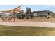 Community playground offers a jungle gym, seating, and swing sets at 24333 E 41St Ave, Aurora, CO 80019