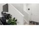 View of the staircase and front door, including a TV sitting above an electric fireplace at 24333 E 41St Ave, Aurora, CO 80019