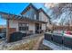 Backyard patio featuring an outdoor kitchen, seating, and pergola at 745 S Eliot St, Denver, CO 80219