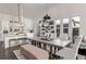 Bright dining area with a large table, seating for eight, open concept kitchen, and lots of natural light at 745 S Eliot St, Denver, CO 80219