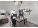 Well lit home office space with modern desk setup, shelving, and large windows at 745 S Eliot St, Denver, CO 80219