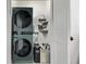 A modern laundry room with stylish, high-end, stacked washer and dryer at 745 S Eliot St, Denver, CO 80219