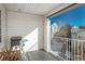 The balcony includes a table, chairs, and a grill with a view of the neighborhood at 12281 E Tennessee Dr # 303, Aurora, CO 80012