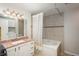 Clean bathroom featuring a shower-tub combo at 12281 E Tennessee Dr # 303, Aurora, CO 80012