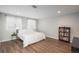 Bright bedroom featuring wood flooring and large windows at 12281 E Tennessee Dr # 303, Aurora, CO 80012
