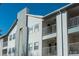 The building exterior features multiple balconies at 12281 E Tennessee Dr # 303, Aurora, CO 80012
