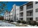 The building exterior features multiple balconies at 12281 E Tennessee Dr # 303, Aurora, CO 80012