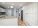 Well-lit kitchen features white cabinets, granite counters, and stainless steel refrigerator at 12281 E Tennessee Dr # 303, Aurora, CO 80012