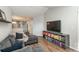 Inviting living room with a sectional couch, TV, and lots of natural light at 12281 E Tennessee Dr # 303, Aurora, CO 80012